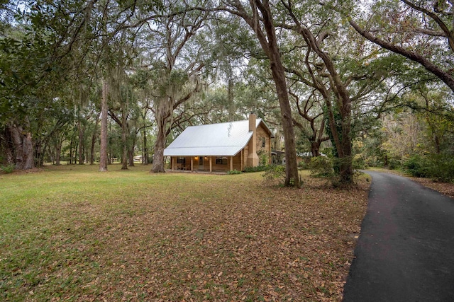 5850 Capo Island Rd, Saint Augustine, FL 32095 - view of grassy yard featuring a porch