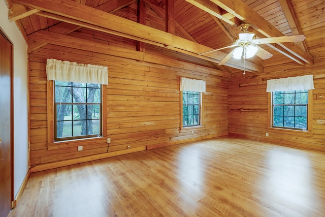 5850 Capo Island Rd, Saint Augustine, FL 32095 - empty room with healthy amount of natural light, wood ceiling, a ceiling fan, wood finished floors, and wood walls
