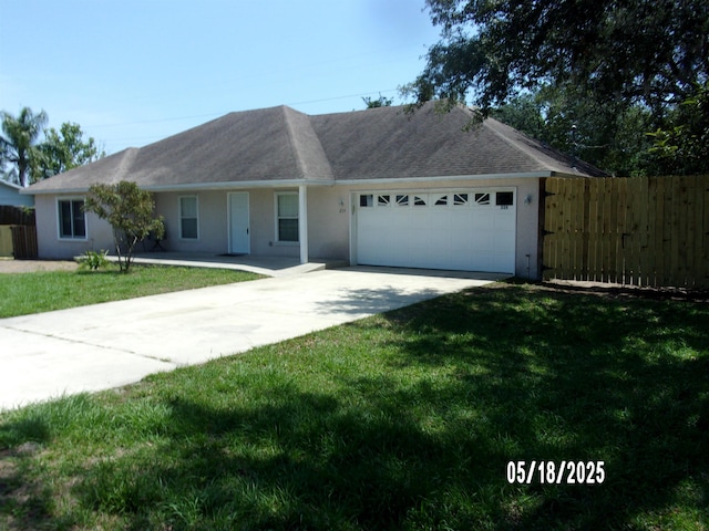 single story home with an attached garage, concrete driveway, and stucco siding