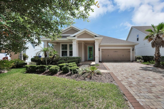164 Front Door Ln, Saint Augustine, FL 32095 - view of front of home with an attached garage, driveway, and a front yard