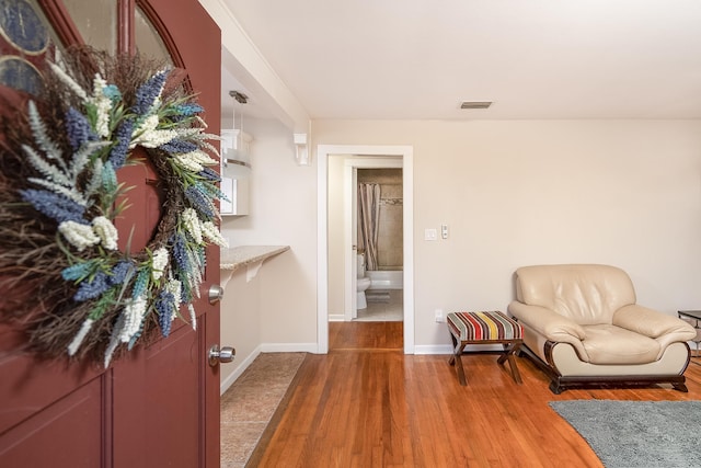 sitting room featuring hardwood / wood-style floors