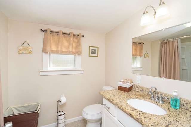 bathroom featuring tile patterned flooring, vanity, toilet, and curtained shower