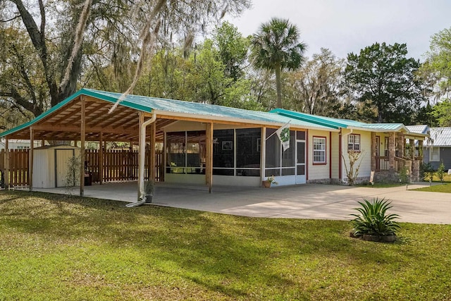 exterior space with a lawn and a storage shed