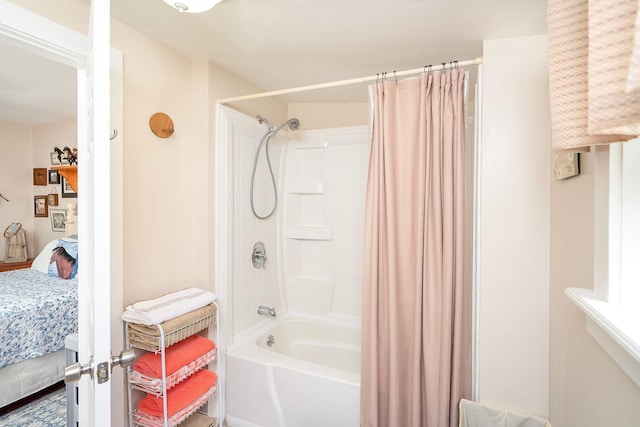 bathroom with shower / tub combo with curtain