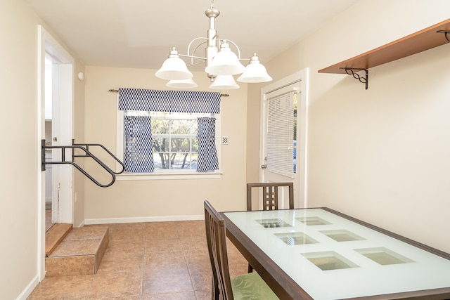 bedroom featuring light tile patterned floors and an inviting chandelier