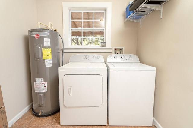 laundry room featuring washing machine and clothes dryer, electric water heater, and light tile patterned floors