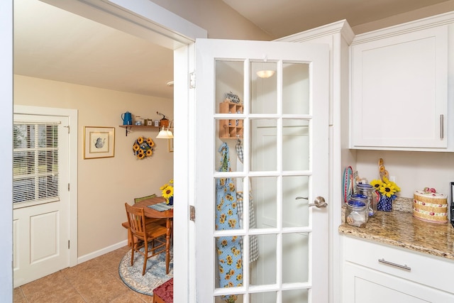 entryway featuring light tile patterned floors