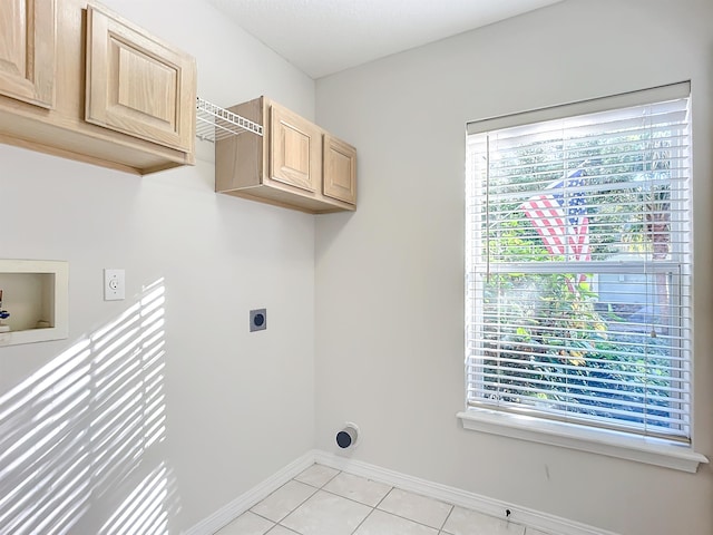 laundry room with hookup for an electric dryer, light tile patterned flooring, cabinets, and washer hookup