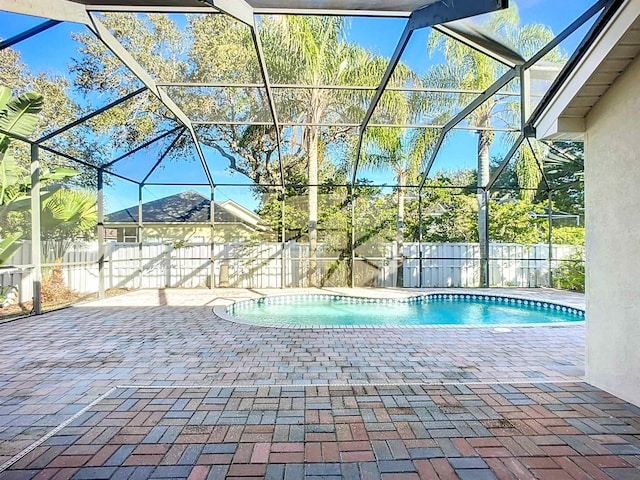 view of pool featuring a lanai and a patio