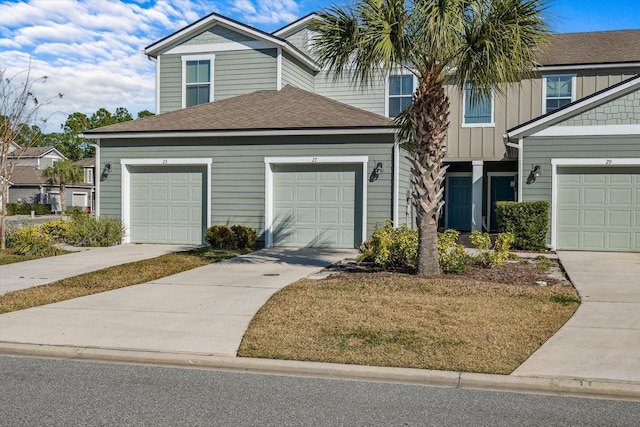 view of front facade with a garage and a front yard