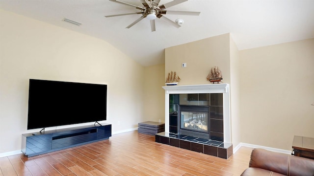 256 N Hidden Tree Dr, Saint Augustine, FL 32086 - living area with a fireplace, wood finished floors, lofted ceiling, a ceiling fan, and baseboards