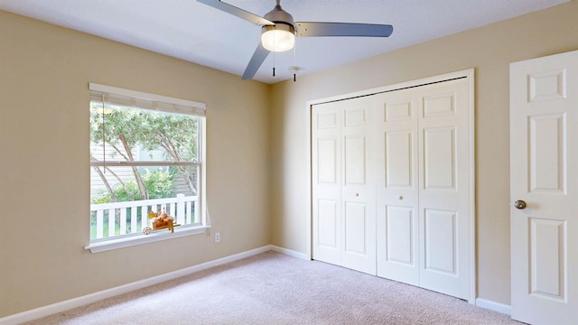 256 N Hidden Tree Dr, Saint Augustine, FL 32086 - unfurnished bedroom featuring multiple windows, carpet, and a closet