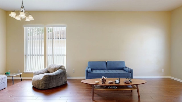 256 N Hidden Tree Dr, Saint Augustine, FL 32086 - living area with wood finished floors, a chandelier, and baseboards