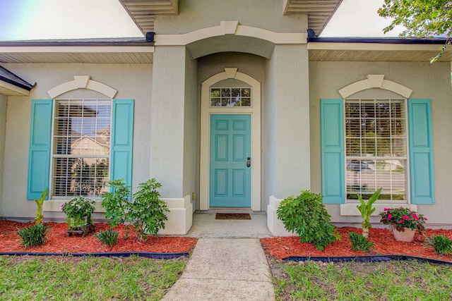 256 N Hidden Tree Dr, Saint Augustine, FL 32086 - doorway to property featuring stucco siding