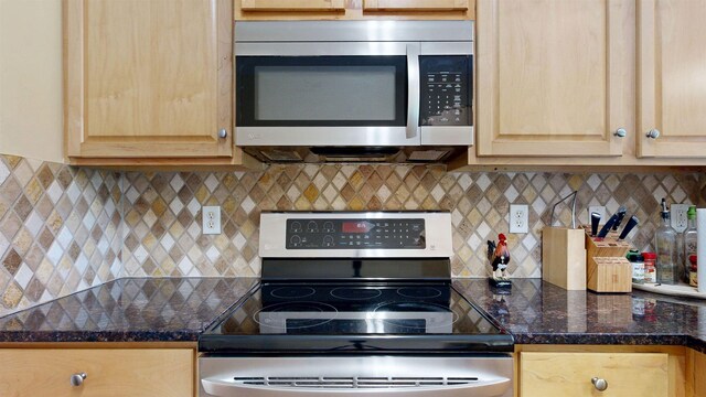 256 N Hidden Tree Dr, Saint Augustine, FL 32086 - kitchen with stainless steel appliances, light brown cabinetry, and dark countertops