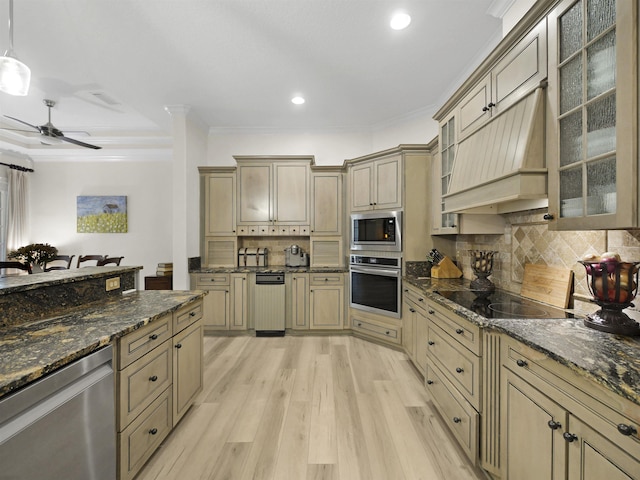 476 Ocean Forest Dr, Saint Augustine, FL 32080 - kitchen featuring appliances with stainless steel finishes, light wood-style floors, cream cabinetry, tasteful backsplash, and ornamental molding