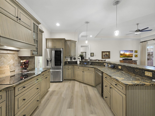 476 Ocean Forest Dr, Saint Augustine, FL 32080 - kitchen featuring appliances with stainless steel finishes, a sink, light wood-style flooring, a peninsula, and custom exhaust hood