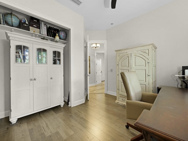 476 Ocean Forest Dr, Saint Augustine, FL 32080 - home office with a ceiling fan, baseboards, visible vents, and wood finished floors