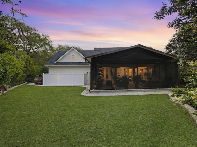 476 Ocean Forest Dr, Saint Augustine, FL 32080 - view of front of home featuring a yard, a shingled roof, and a sunroom