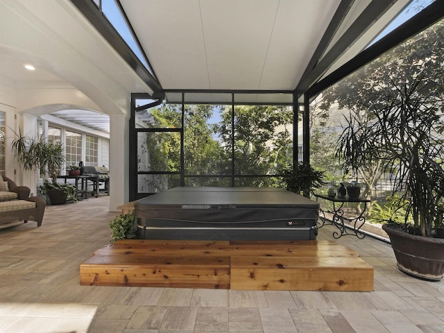 476 Ocean Forest Dr, Saint Augustine, FL 32080 - sunroom with arched walkways and a jacuzzi