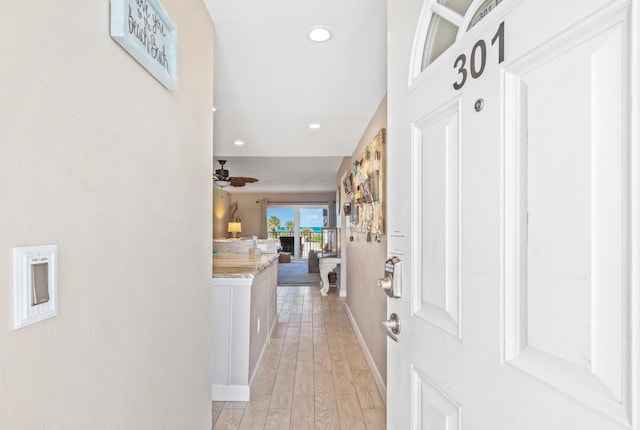 hallway featuring light hardwood / wood-style flooring