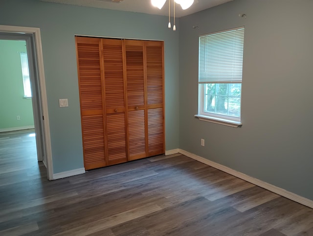 304 Las Olas Rd, Saint Augustine, FL 32084 - unfurnished bedroom with a closet and dark wood-style flooring