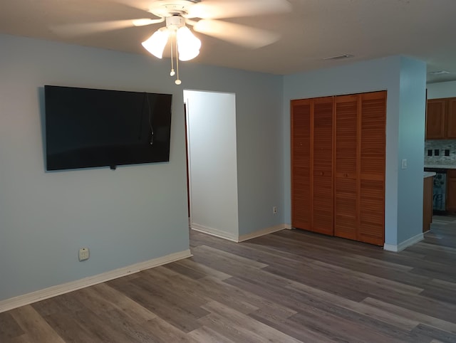 304 Las Olas Rd, Saint Augustine, FL 32084 - unfurnished bedroom with wood finished floors, a closet, and ceiling fan
