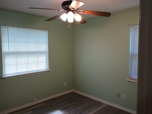 304 Las Olas Rd, Saint Augustine, FL 32084 - empty room with dark wood finished floors, a ceiling fan, and a textured ceiling
