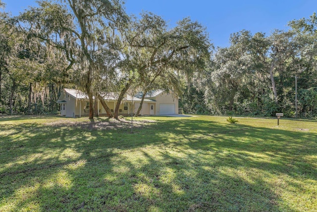 view of yard featuring a garage