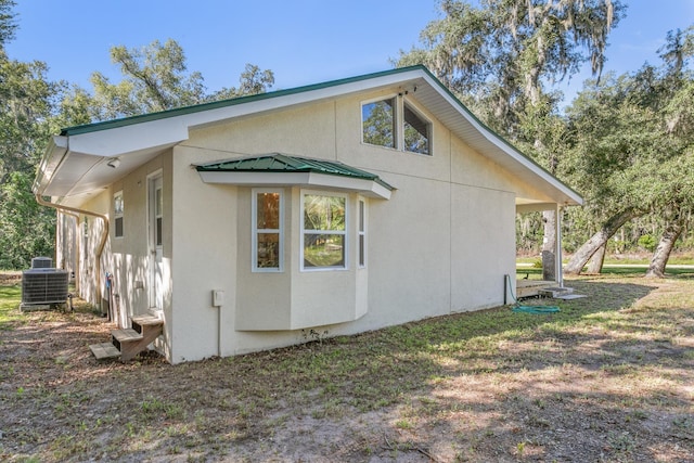 view of side of property featuring cooling unit