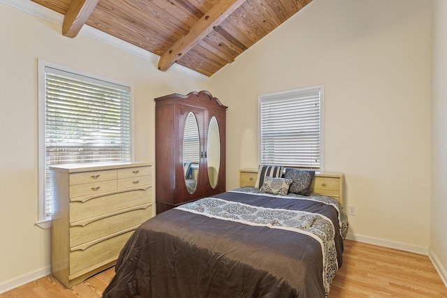 bedroom featuring wood ceiling, vaulted ceiling with beams, and light hardwood / wood-style floors