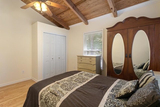 bedroom featuring wood ceiling, ceiling fan, lofted ceiling with beams, light hardwood / wood-style flooring, and a closet