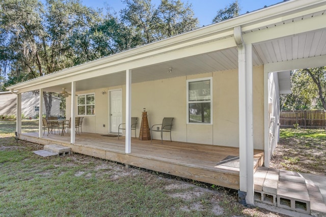 exterior space featuring ceiling fan