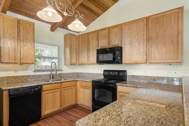 kitchen with light stone countertops, sink, dark hardwood / wood-style flooring, vaulted ceiling, and black appliances