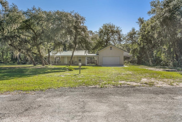 view of front facade featuring a garage and a front lawn