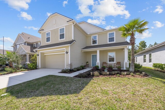 811 Sandstone Dr, Saint Augustine, FL 32086 - craftsman-style home featuring board and batten siding, a front yard, covered porch, a garage, and driveway