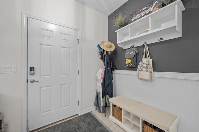811 Sandstone Dr, Saint Augustine, FL 32086 - mudroom featuring a wainscoted wall and a textured ceiling