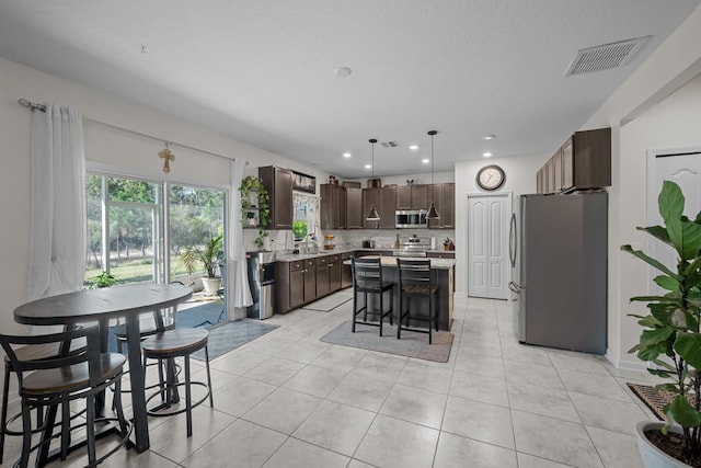 811 Sandstone Dr, Saint Augustine, FL 32086 - dining space with light tile patterned floors, visible vents, and recessed lighting