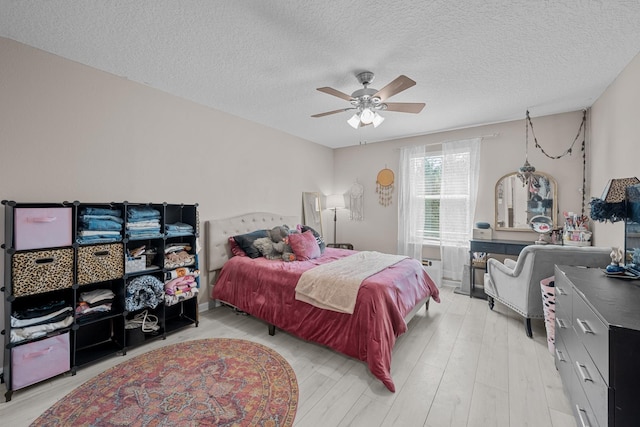811 Sandstone Dr, Saint Augustine, FL 32086 - bedroom with a textured ceiling, a ceiling fan, and light wood finished floors