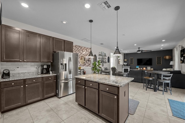 811 Sandstone Dr, Saint Augustine, FL 32086 - kitchen with dark brown cabinetry, visible vents, a ceiling fan, and stainless steel refrigerator with ice dispenser