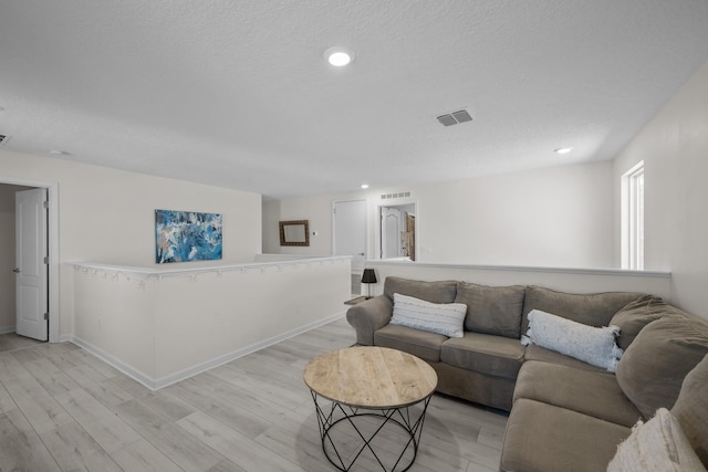 811 Sandstone Dr, Saint Augustine, FL 32086 - living room featuring light wood-type flooring, visible vents, and recessed lighting