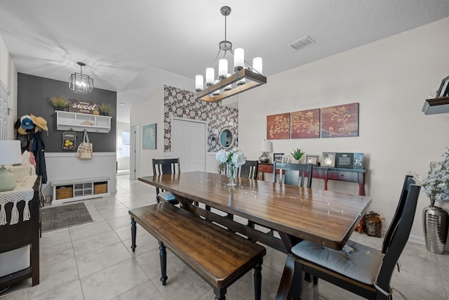 811 Sandstone Dr, Saint Augustine, FL 32086 - dining space featuring visible vents, a wainscoted wall, light tile patterned floors, a notable chandelier, and a textured ceiling