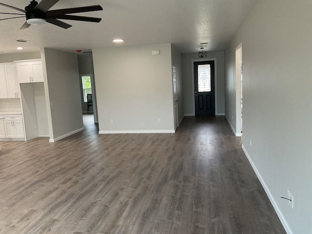 entrance foyer with dark hardwood / wood-style floors and ceiling fan