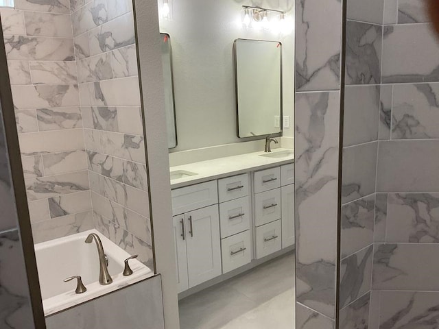 bathroom with a tub to relax in and vanity