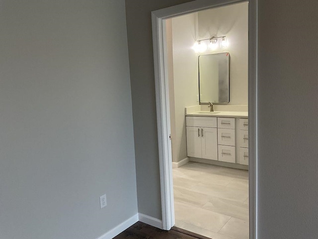 bathroom featuring hardwood / wood-style floors and vanity