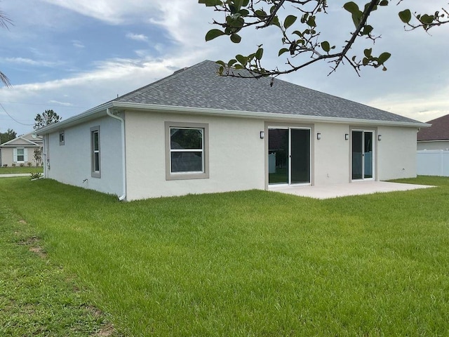 5 Fifer Ln, Palm Coast, FL 32137 - back of property with stucco siding, a shingled roof, and a patio area
