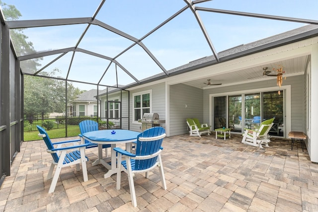 view of patio / terrace with glass enclosure and ceiling fan