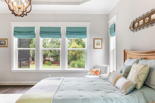 bedroom featuring multiple windows, crown molding, dark hardwood / wood-style flooring, and a chandelier