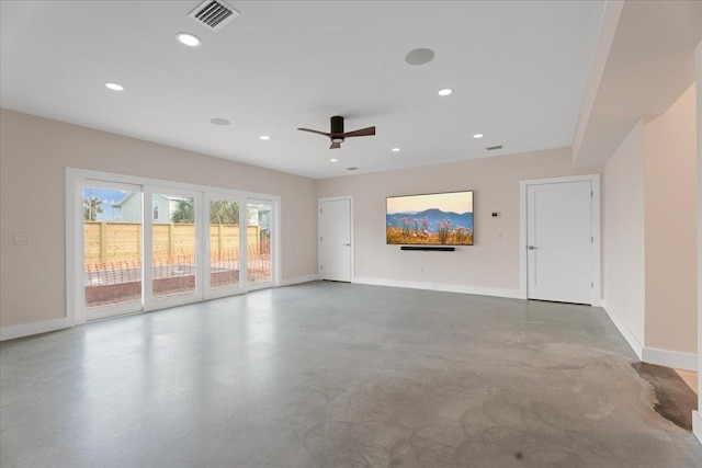 unfurnished living room featuring visible vents, baseboards, and concrete flooring