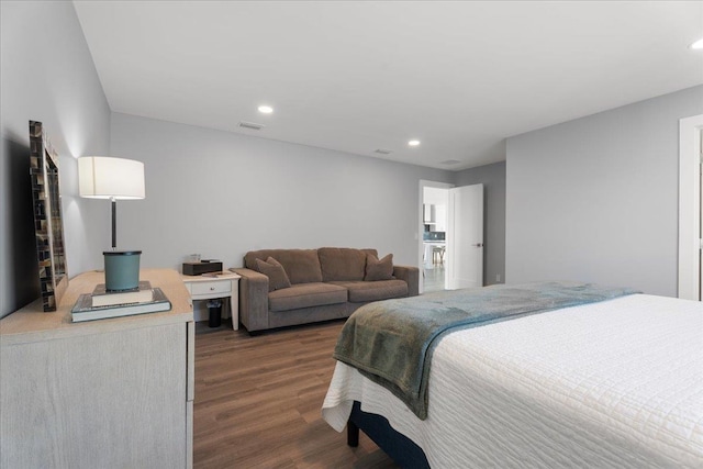 bedroom featuring dark wood-style floors, visible vents, and recessed lighting